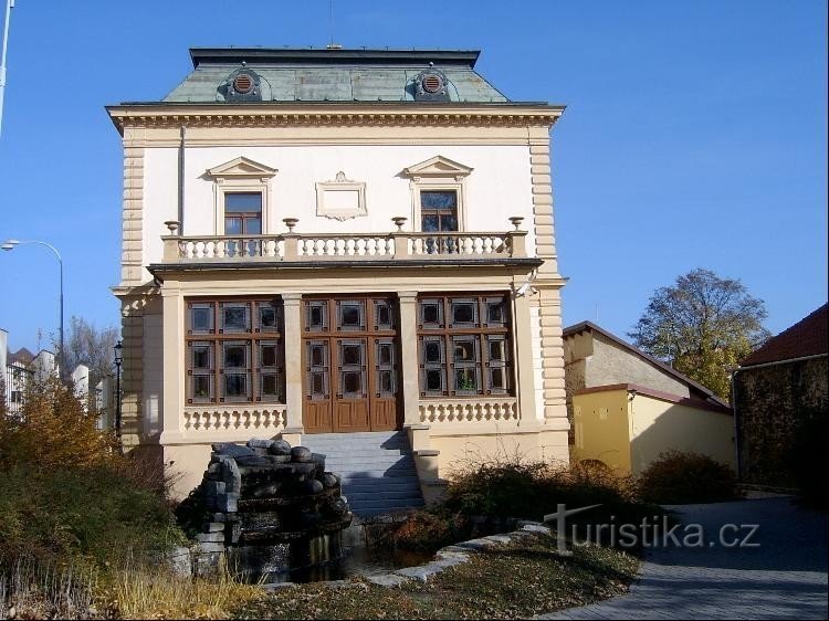 West side: Park with fountain and statue of J. Živce adjacent to the villa, bears the name